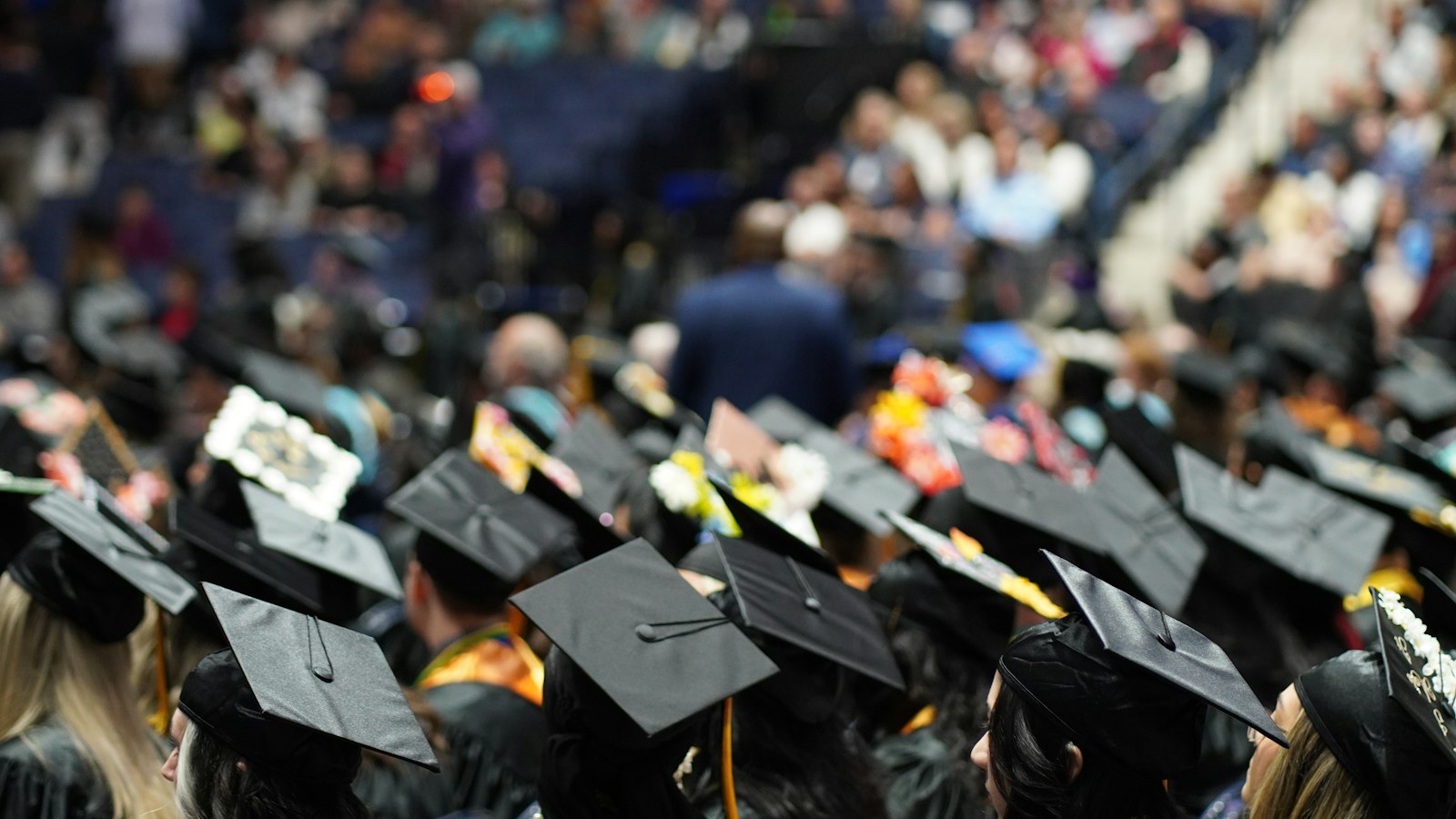 Graduates in caps and gowns at a graduation ceremony