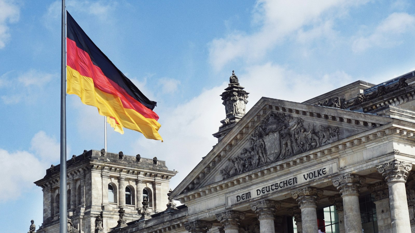 German flag above the Reichstag building in Berlin